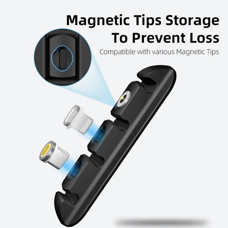 Black soft plastic magnetic desktop charging cable organiser stand on a desk.