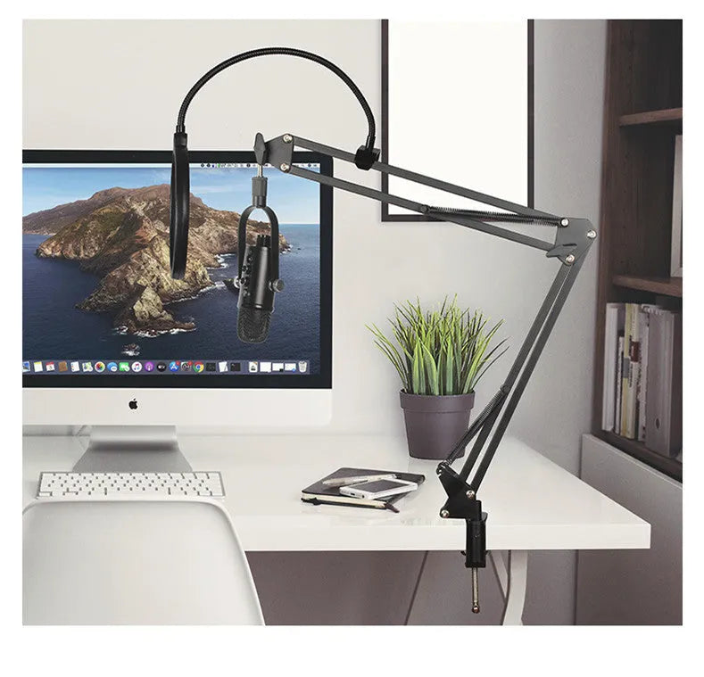 JIY BM-86PRO black USB condenser microphone with metal stand and foam cover on a desktop.