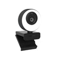 Black USB webcam with a magnetic privacy cover on a laptop, showing its compact ABS design.