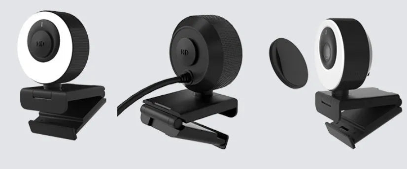Black USB webcam with a magnetic privacy cover on a laptop, showing its compact ABS design.