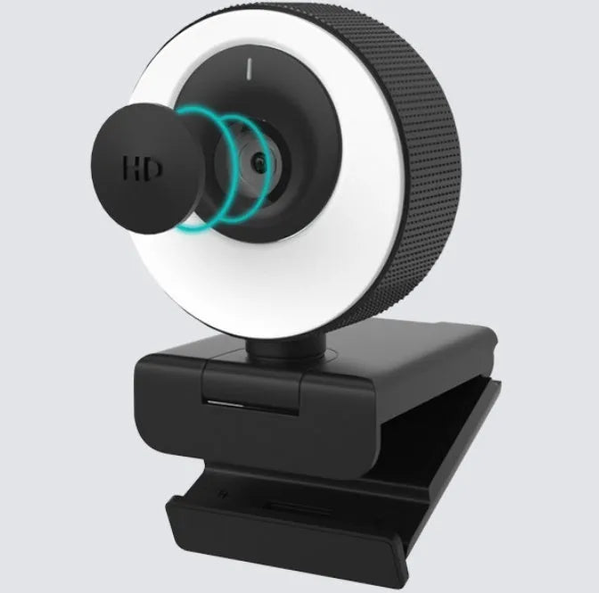 Black USB webcam with a magnetic privacy cover on a laptop, showing its compact ABS design.