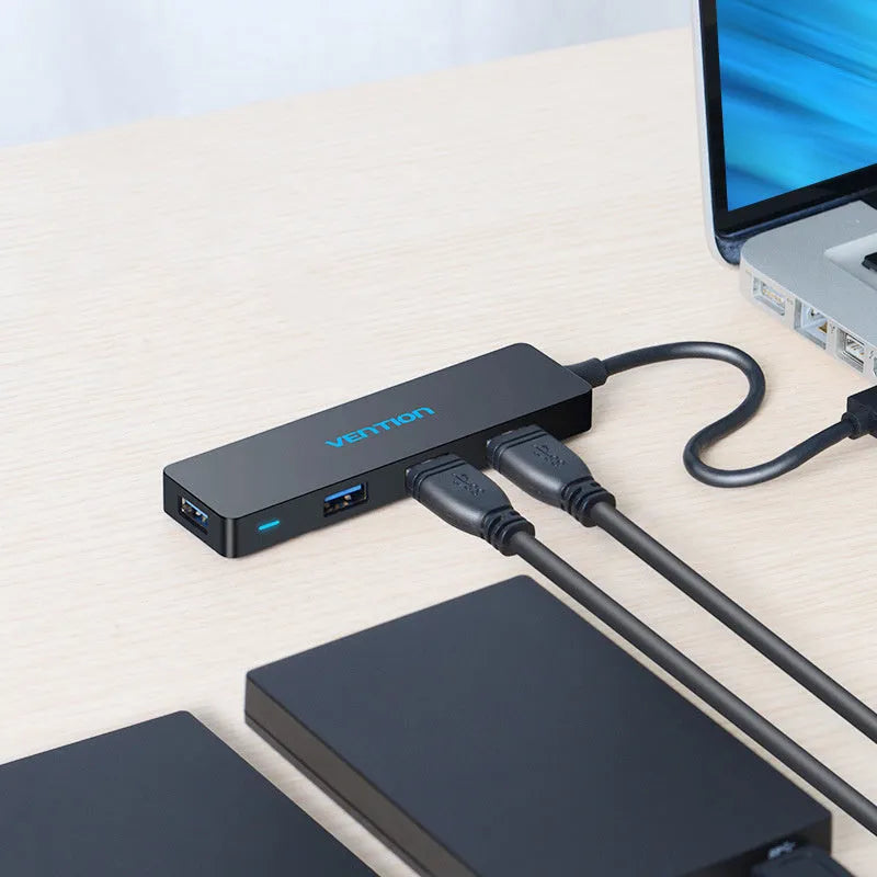Black four-port USB 3.0 hub splitter with 0.15 metre cable and nickel-plated connectors