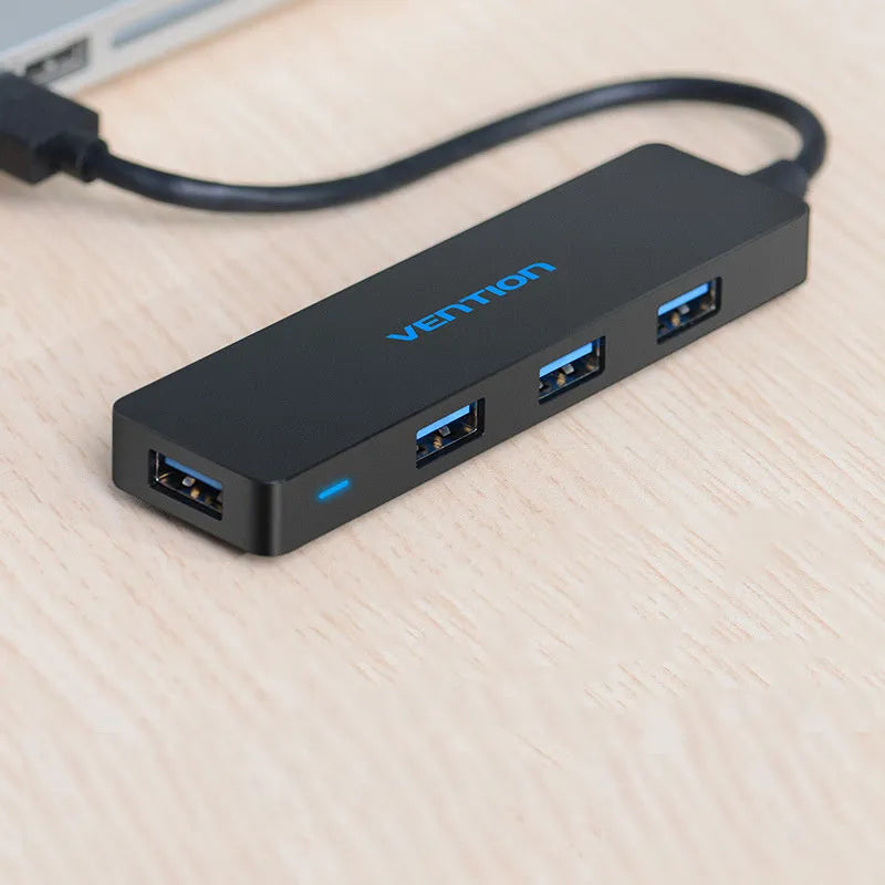 Black four-port USB 3.0 hub splitter with 0.15 metre cable and nickel-plated connectors
