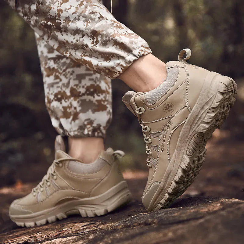 Men's military hiking boots in black with PU upper, rubber sole, low-tube design, and car suture detailing