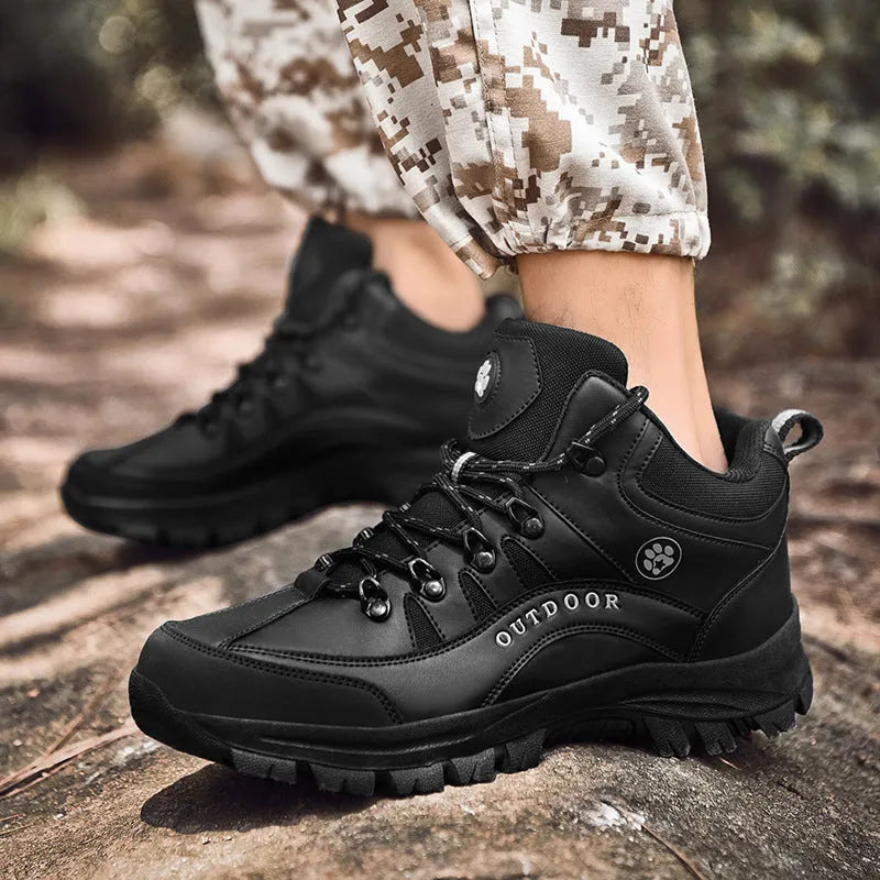 Men's military hiking boots in black with PU upper, rubber sole, low-tube design, and car suture detailing