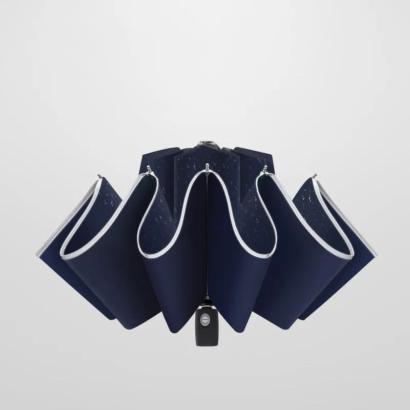 Black automatic reverse umbrella showing three-fold design with non-slip plastic handle