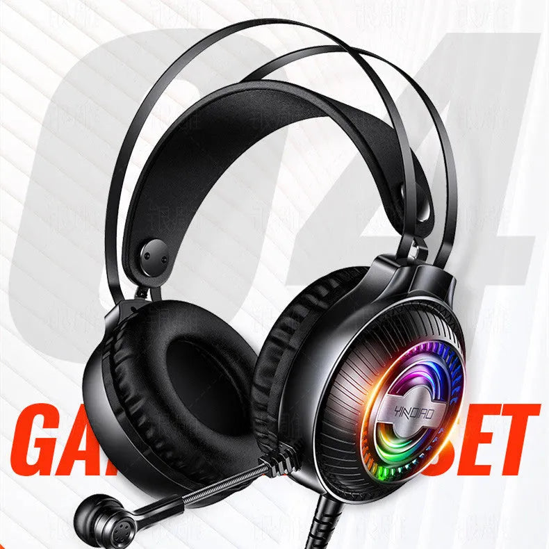 Black wired over-ear computer headset with microphone and 3.5mm plug on a desk.