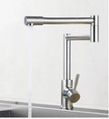 Silver stainless steel kitchen tap with dual rotating spouts for hot and cold water