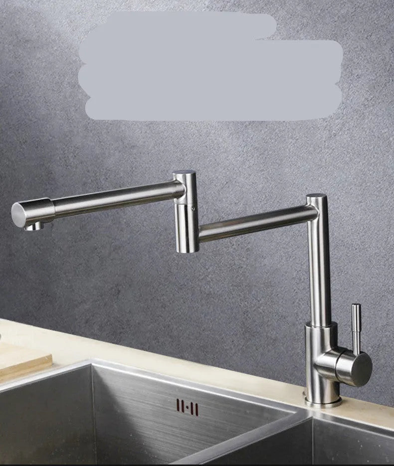 Silver stainless steel kitchen tap with dual rotating spouts for hot and cold water