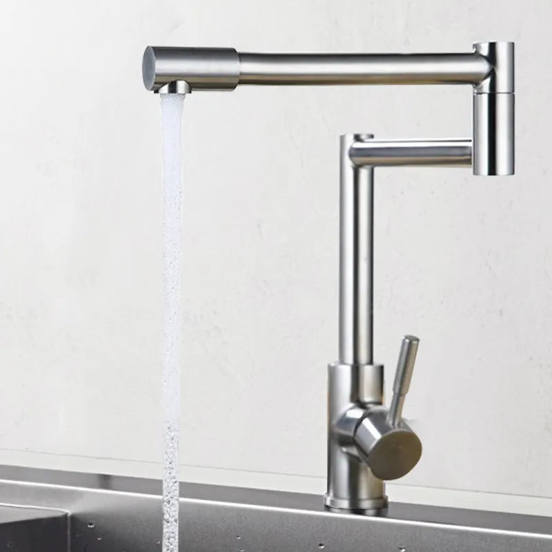 Silver stainless steel kitchen tap with dual rotating spouts for hot and cold water