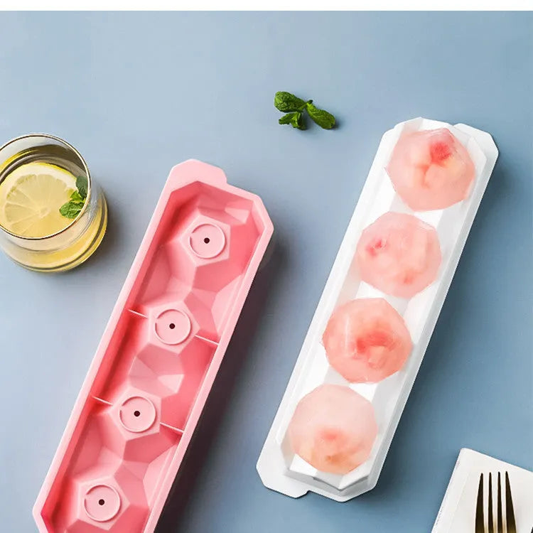 Silicone ice tray producing large ice hockey artefacts and geometric ice cubes in multiple colour variations