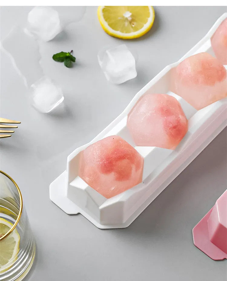 Silicone ice tray producing large ice hockey artefacts and geometric ice cubes in multiple colour variations