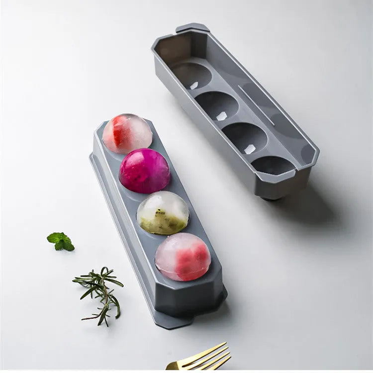 Silicone ice tray producing large ice hockey artefacts and geometric ice cubes in multiple colour variations