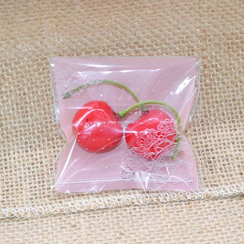 Pink self-adhesive plastic packaging bags for handmade soap with UV printing measuring 7x7cm