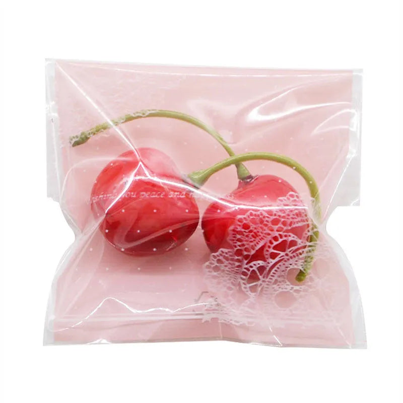 Pink self-adhesive plastic packaging bags for handmade soap with UV printing measuring 7x7cm