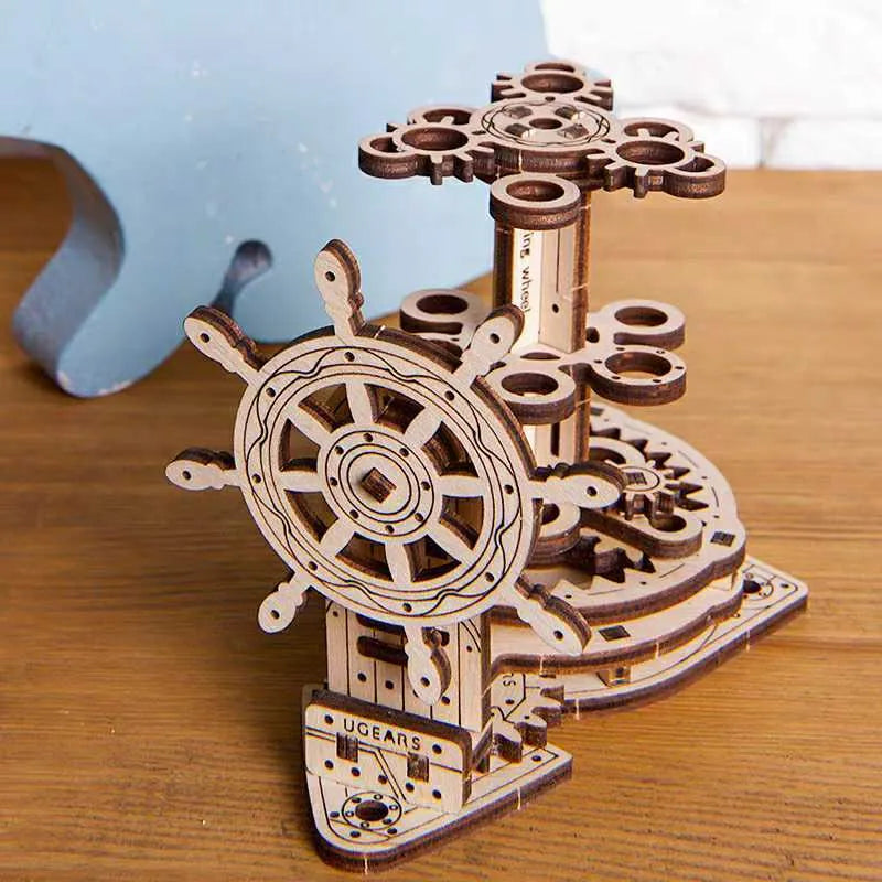 Wooden rotating pen holder with Ukrainian steering wheel design on wooden base