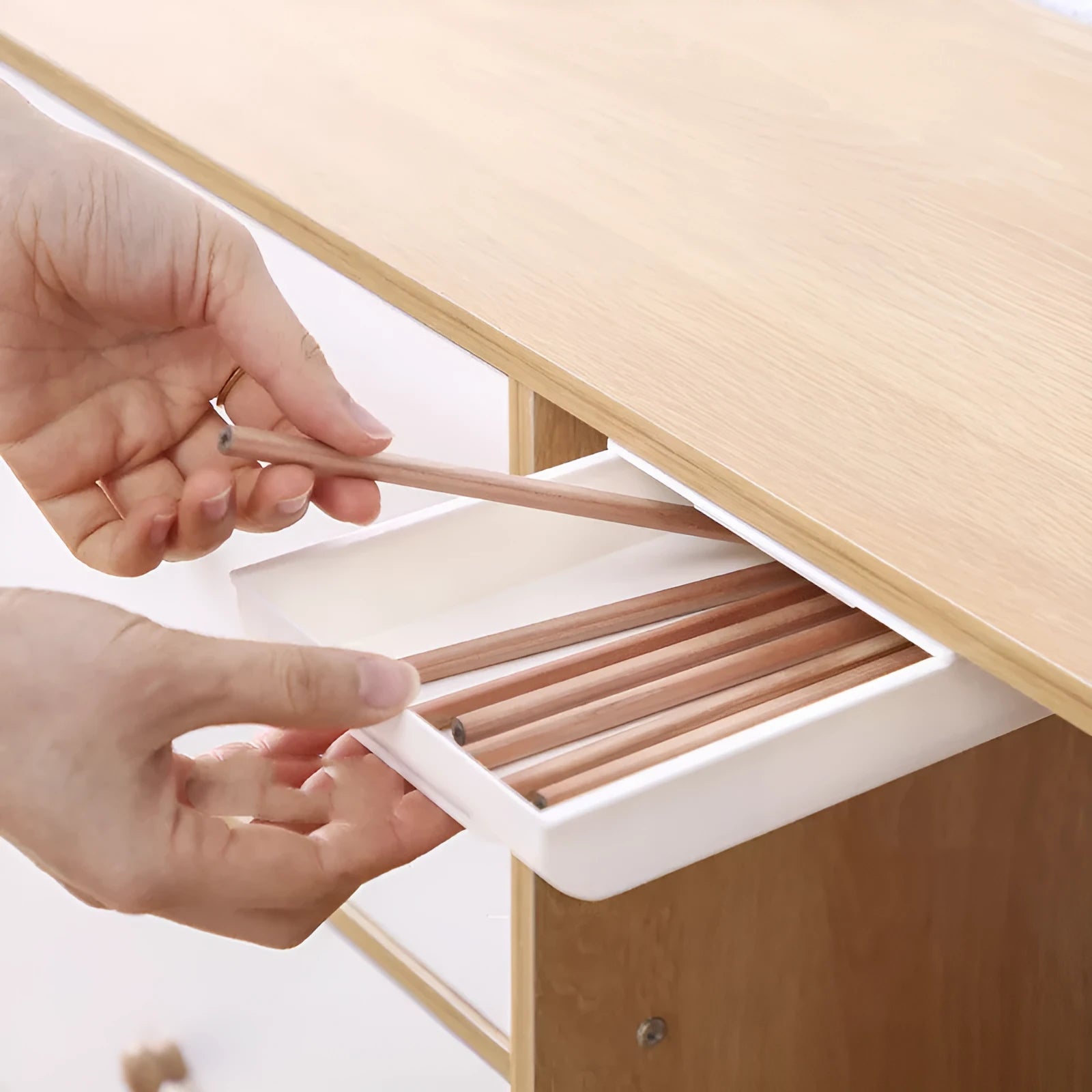 Japanese-style plastic drawer storage box hidden under table in grey, available in small large extra large sizes