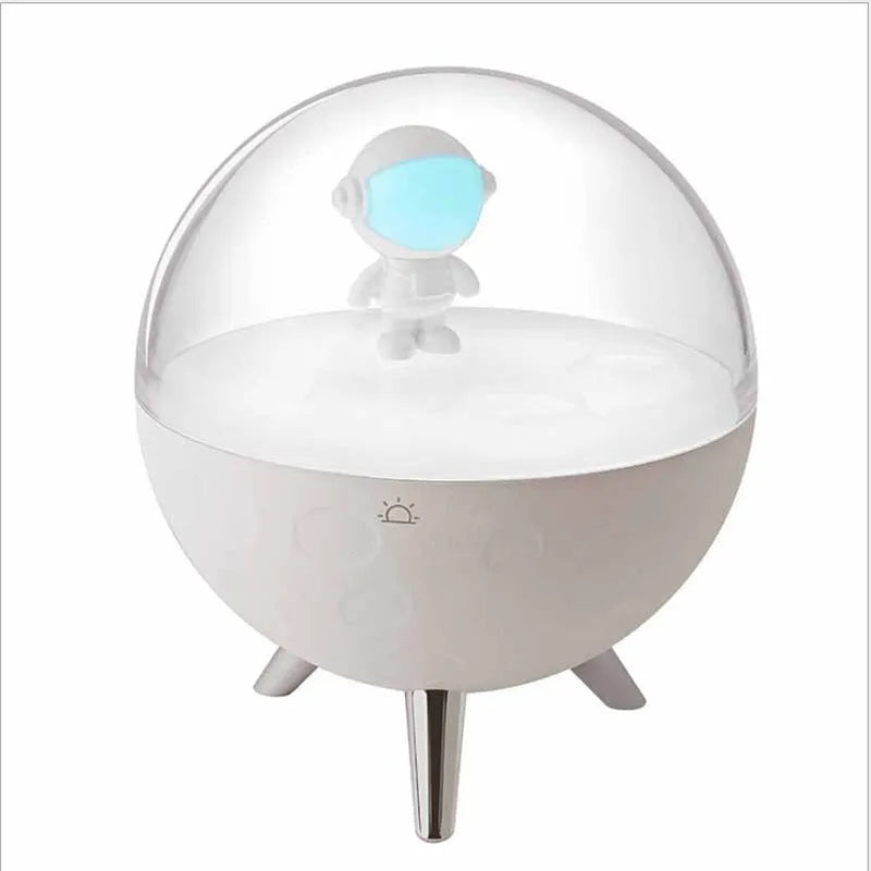 Modern cartoon-style USB LED desk lamp on a bedside table, showing white light option.