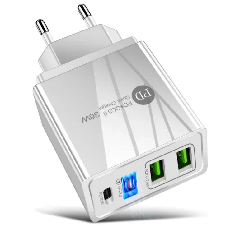 A black 4-port USB fast charging head plugged into a wall socket, with cables connected.