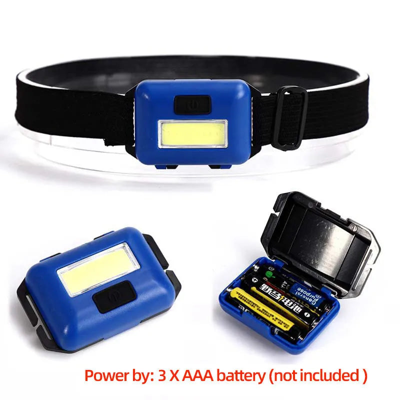 Compact blue outdoor LED headlamp with adjustable strap on a dark background.