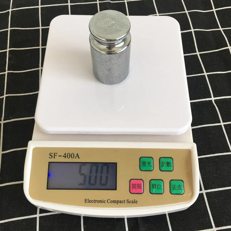 SF-400A black electronic digital kitchen scale on a countertop showing a weight display.
