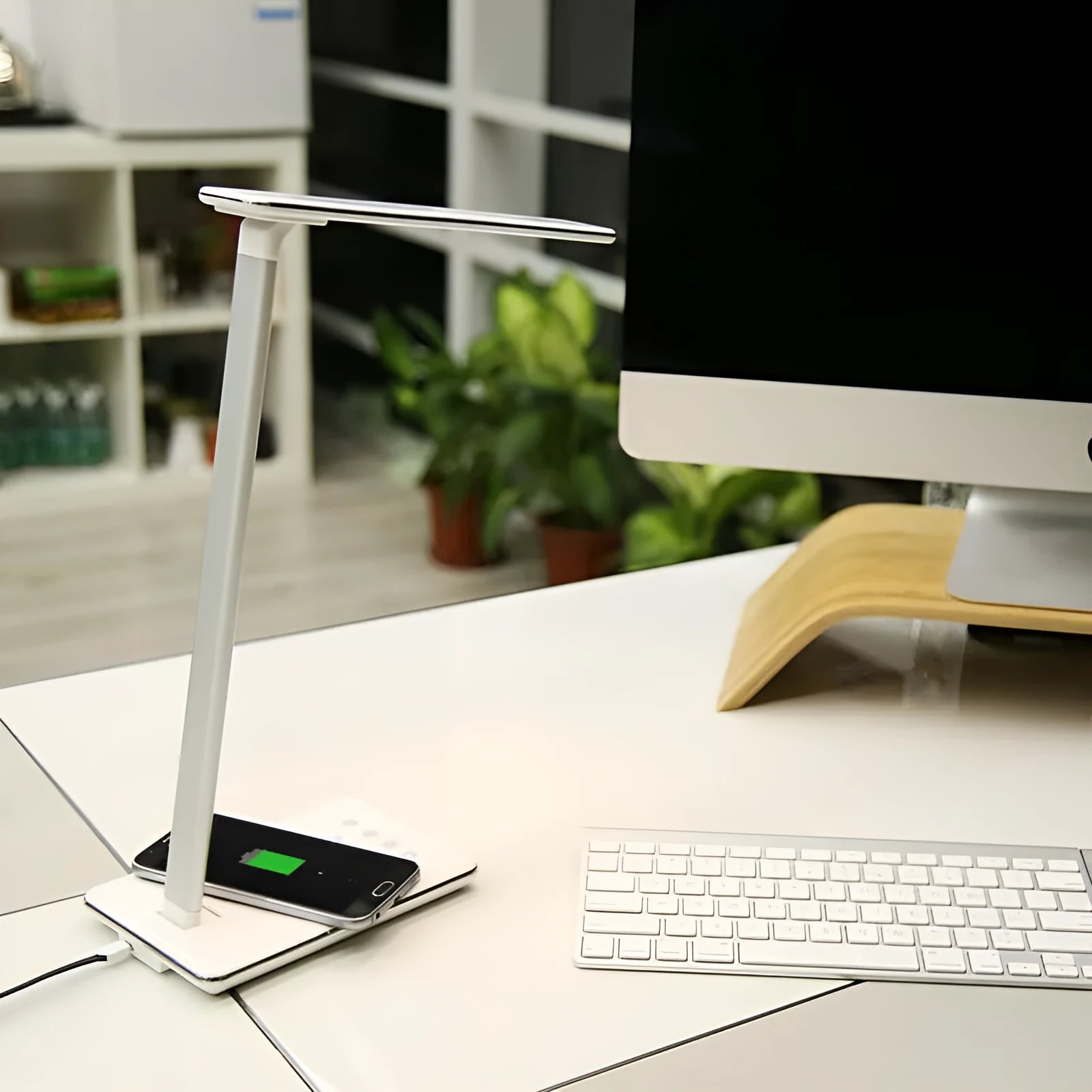 Black and white wireless charging desk lamp with touch controls and aluminium shade.