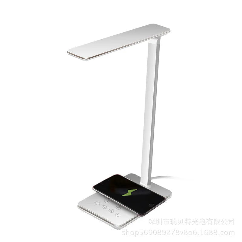 Black and white wireless charging desk lamp with touch controls and aluminium shade.