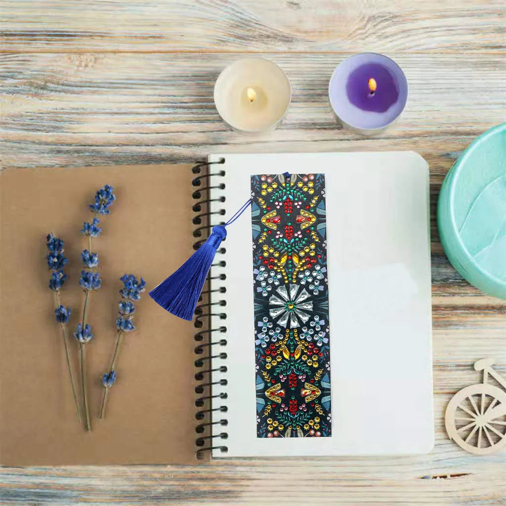 Leather bookmark with hand-embroidered diamond mandala flower design using special-shaped and round diamonds.