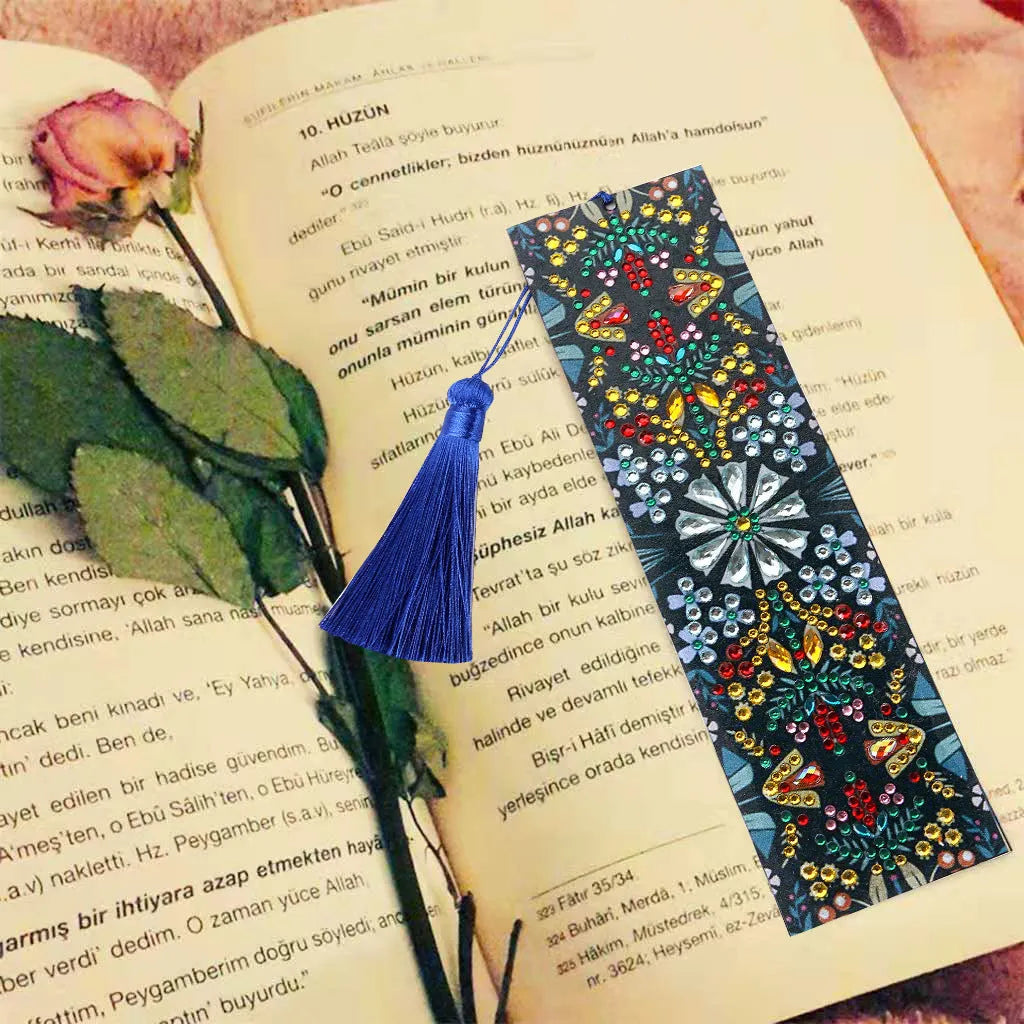 Leather bookmark with hand-embroidered diamond mandala flower design using special-shaped and round diamonds.