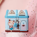 Blue tinplate house-shaped piggy bank with coin slot lid on wooden desk