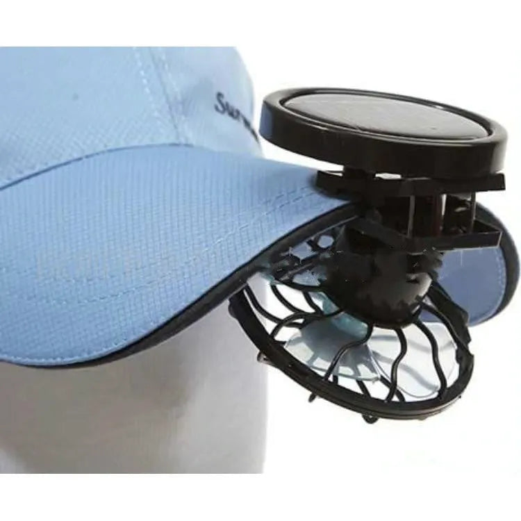 Black solar powered clip-on fan with solar panel for outdoor cooling during camping and travel