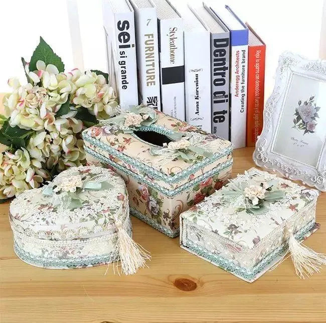 Ceramic jewellery and tissue storage box in bright apricot colour on a wooden surface.