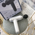 God fascia gun muscle massager in black, red or white colour with USB charging port