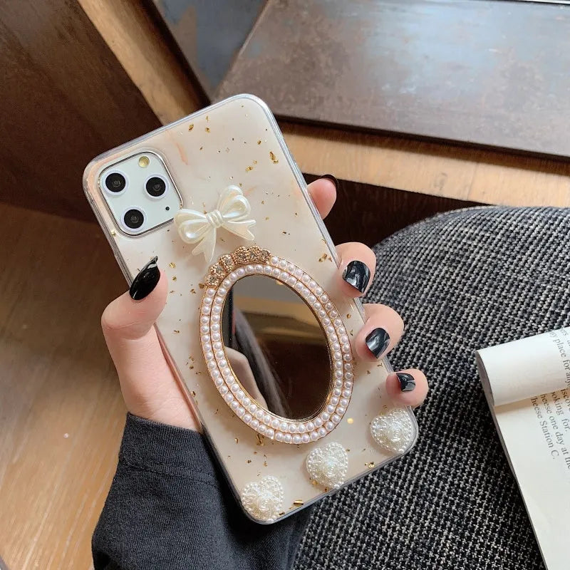 Brown marble patterned silicone iPhone case with rhinestone mirror and bowknot design.