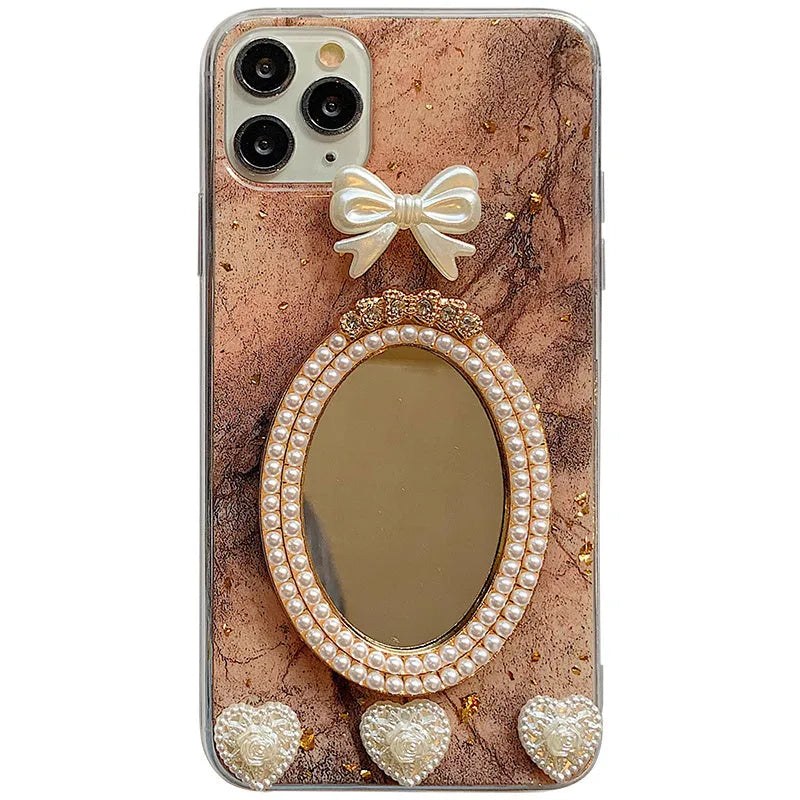 Brown marble patterned silicone iPhone case with rhinestone mirror and bowknot design.