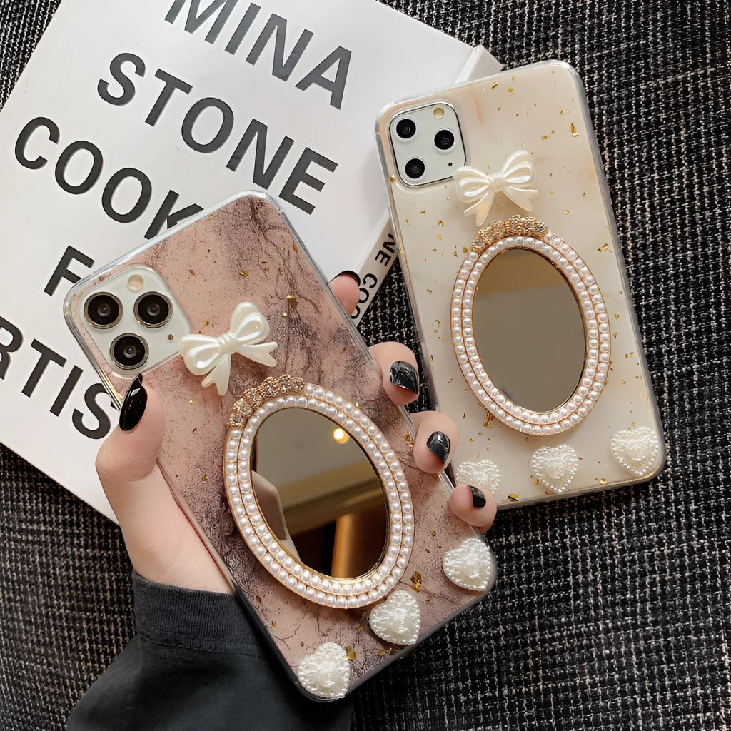 Brown marble patterned silicone iPhone case with rhinestone mirror and bowknot design.