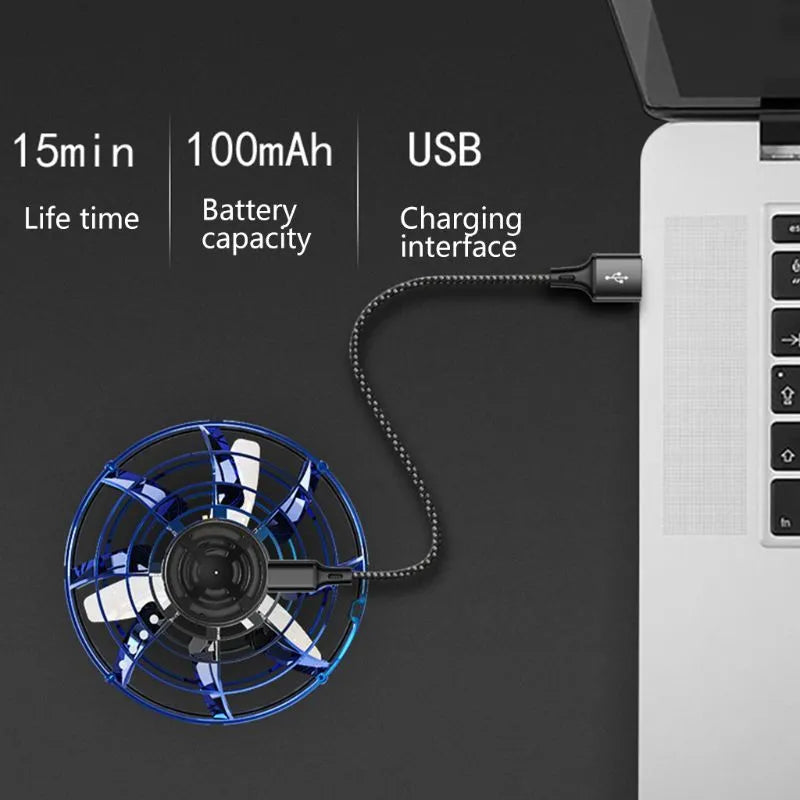 Blue plastic rotating flying gyro induction drone toy 4x8cm manual control