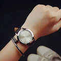 Electronic digital wristwatch with blue LED backlight and number display in black or white