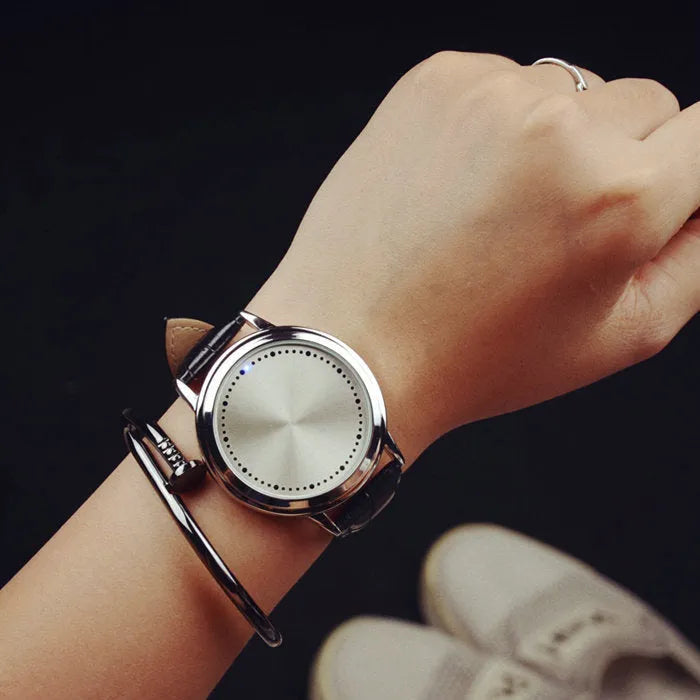 Electronic digital wristwatch with blue LED backlight and number display in black or white