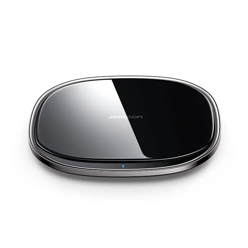 Black 15W wireless phone charger with glass top and zinc alloy body on a desk
