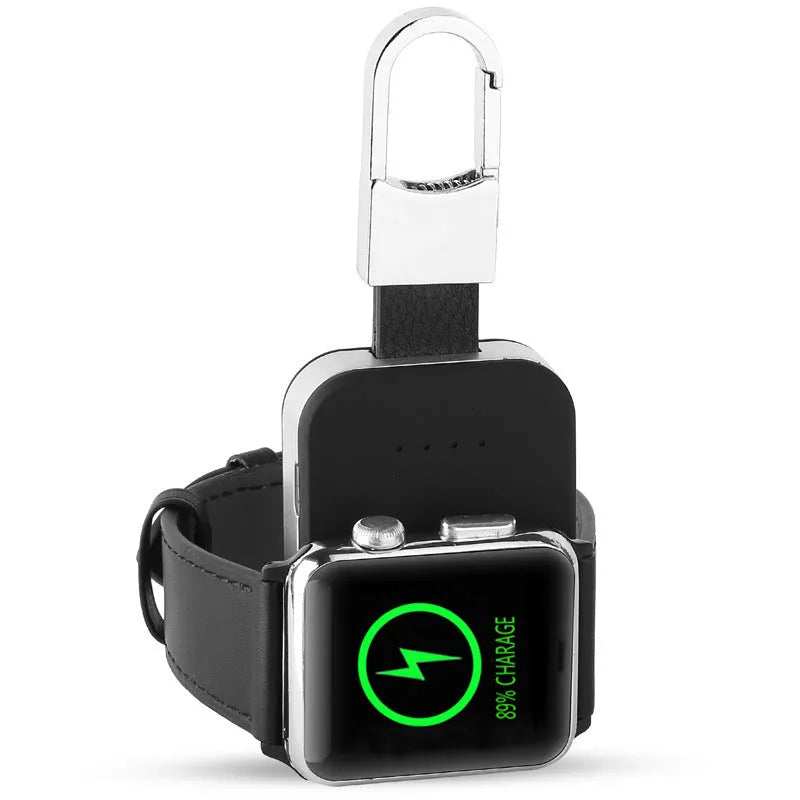 Black Apple Watch portable wireless charger keychain with USB port on a keyring.