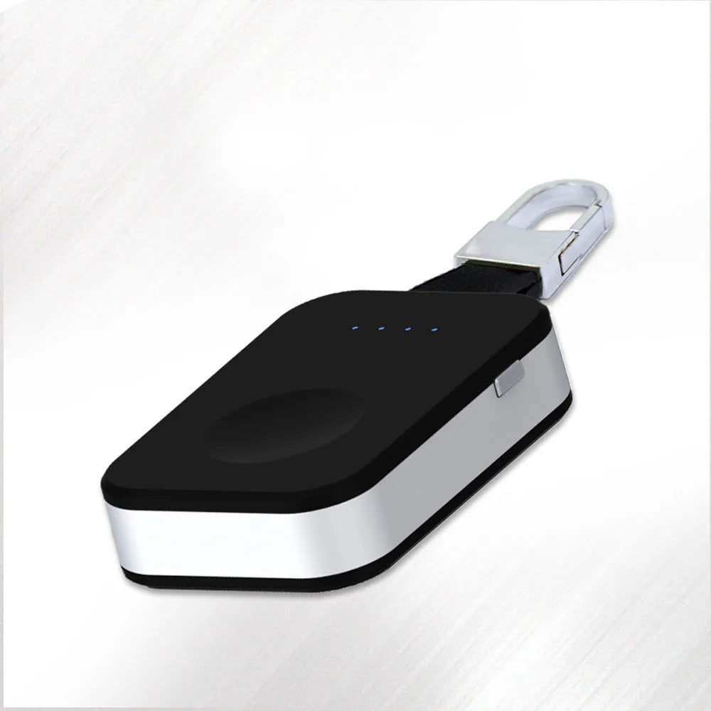 Black Apple Watch portable wireless charger keychain with USB port on a keyring.