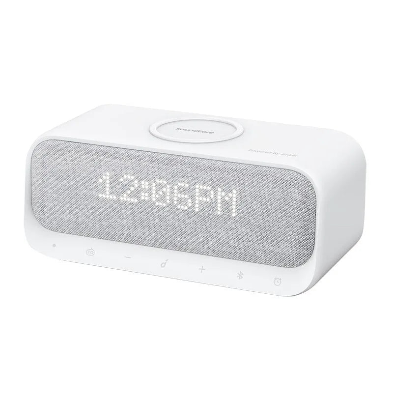 White or pink Anker Soundcore Bluetooth speaker with wireless charging top, display, and compact rectangular design