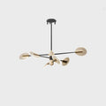 Nordic iron LED chandelier with acrylic elements hanging in a dining room setting