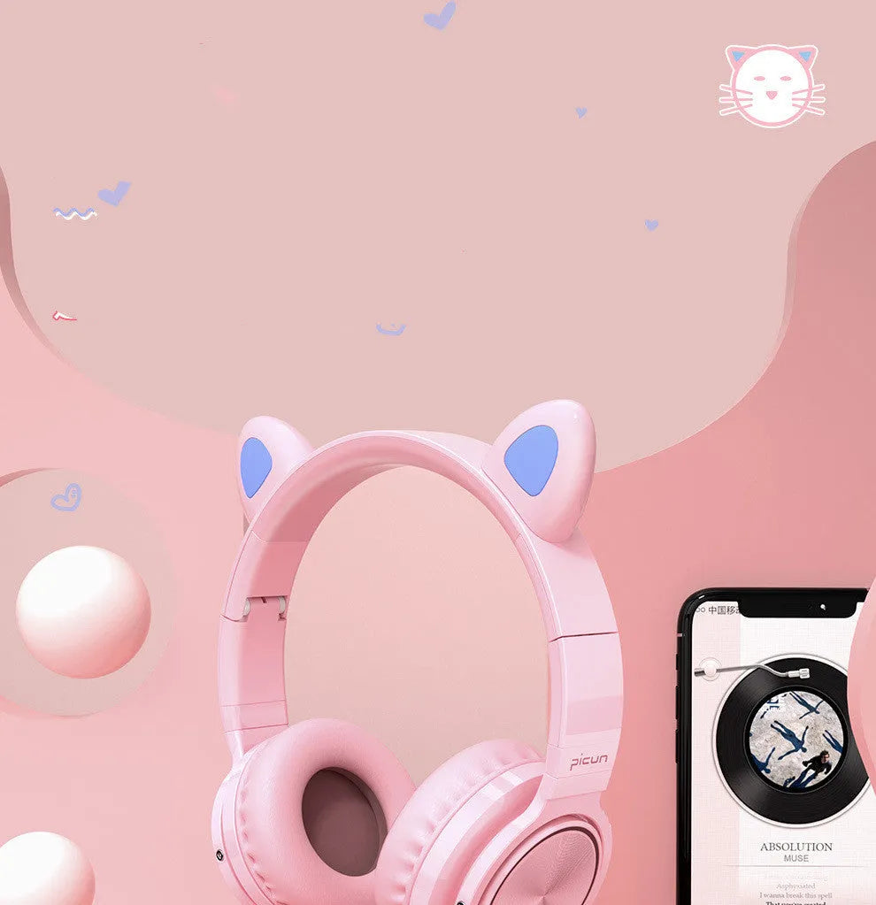 Pink and white Bluetooth over-ear headphones with braided cable and built-in microphone