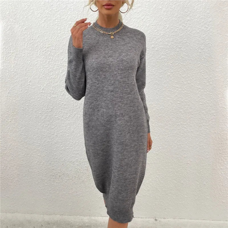 Grey women's crew neck long sleeve casual acrylic sweater on a hanger