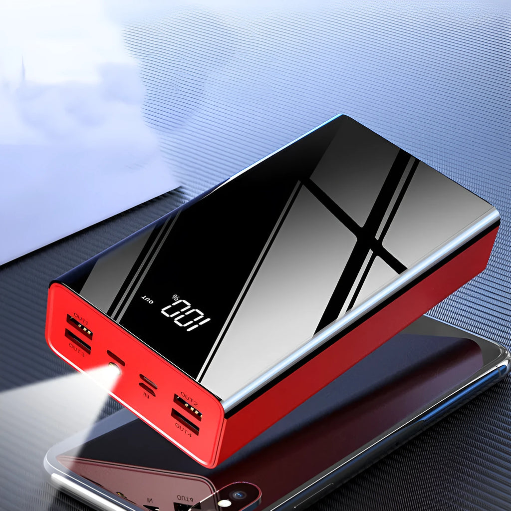Large black or red 40000mAh power bank with LCD display screen showing battery percentage.