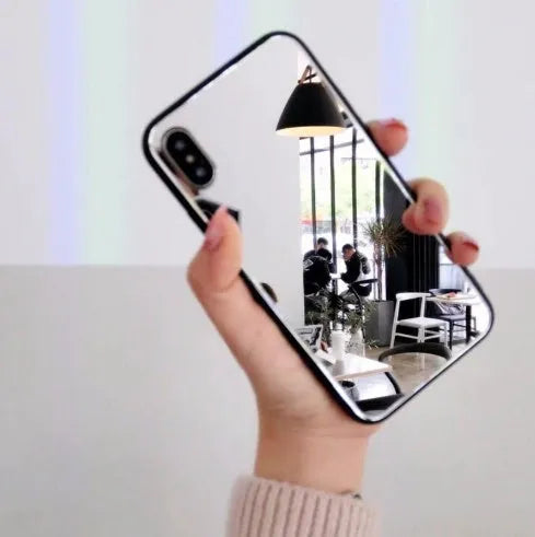 Black clear glass iPhone mirror phone case showing reflective surface and iPhone compatibility