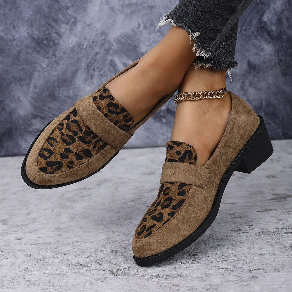 Leopard print suede slip-on shoes with a chunky mid heel and pointed toe on a rubber sole
