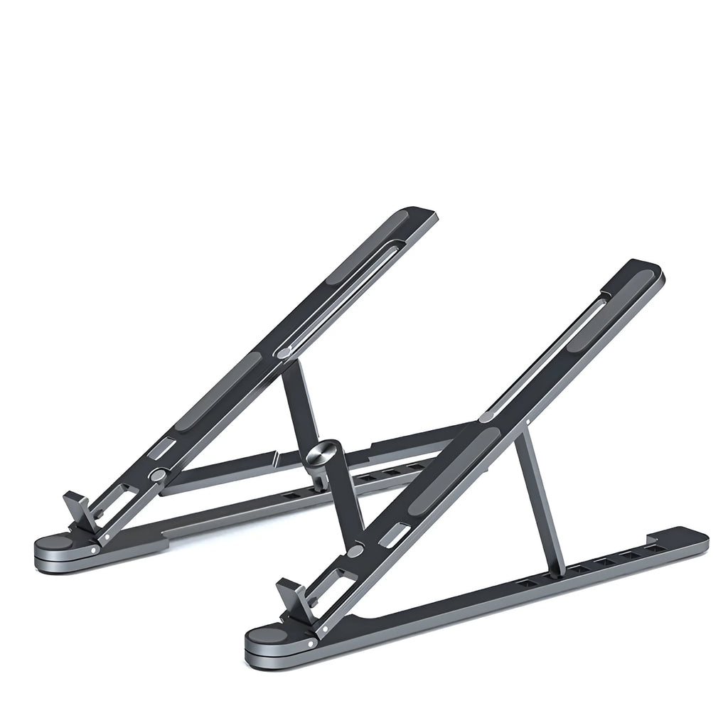 Aluminum foldable laptop stand in silver colour, shown adjusted to an elevated height with a laptop on top.
